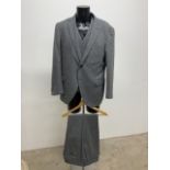 A vintage three piece wool flannel suit by Hackett. Size 46.