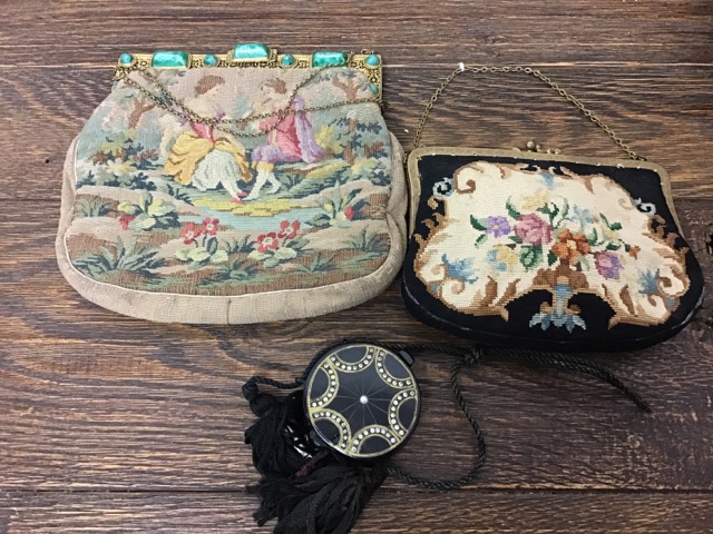 An Edwardian tapestry handbag with chain handle together with a Victorian tapestry bag with filigree