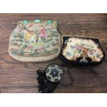 An Edwardian tapestry handbag with chain handle together with a Victorian tapestry bag with filigree