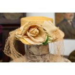 A large collection of ladies vintage hats including hats from the 30s, 40s and a period straw hat