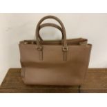 A large leather handbag by Luxury English brand Anya Hindmarch