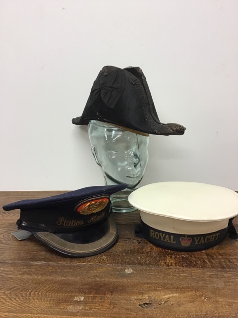 A 19th century bicorn naval hat together with a sailors hat from the Royal Yacht and a station