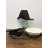 A 19th century bicorn naval hat together with a sailors hat from the Royal Yacht and a station