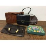 A collection of vintage handbags to include a 1930s deco leather bag 1940s crocodile bag 1960s Waldy