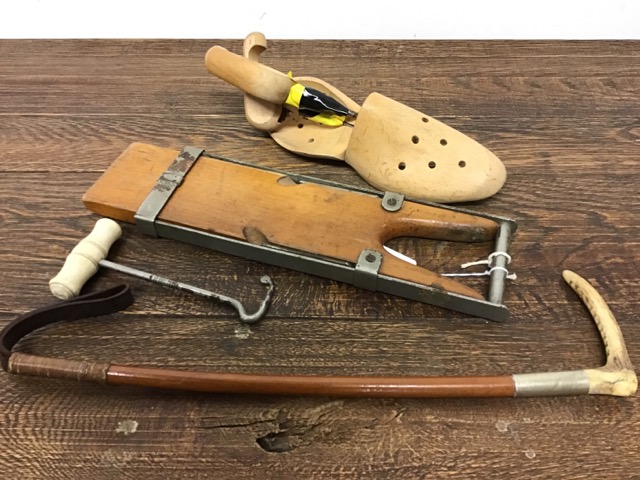 A Riding crop, boot pull and shoe stretchers