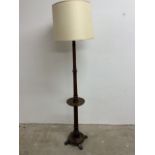 An oak standard lamp with dumb waiter W:30cm x D:30cm x H:170cm