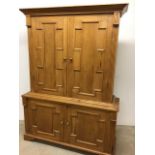 Two piece Victorian waxed pine cupboard fitted with internal shelves W:146cm x D:46cm x H:202cm