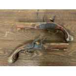 A pair of replica duelling flint lock pistols. 30cm.