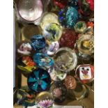 A collection of vintage glass paper weights and snow globes.