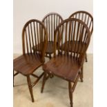 A set of four pine stick back kitchen chairs W:41cm x D:43cm x H:90cm