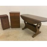 A small oak low drop flap table also with a bedroom cabinet and a wicker storage basket W:93cm x D: