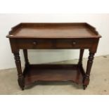 A mahogany galleried two tier buffet with to drawers on turned supports. W:91cm x D:46cm x H:4cm