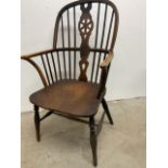 An 18th century yew and elm Windsor arm chair W:58cm x D:47cm x H:102cm