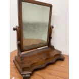 A 19th century swing mirror with distressed glass W:52cm x D:25cm x H:58cm