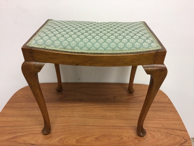 An upholstered piano stool W:51cm x D:31cm x H:48cm