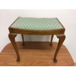 An upholstered piano stool W:51cm x D:31cm x H:48cm