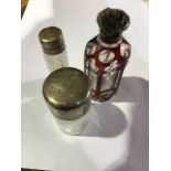 Two sterling silver items to include a silver topped scent bottle with original stopper by John