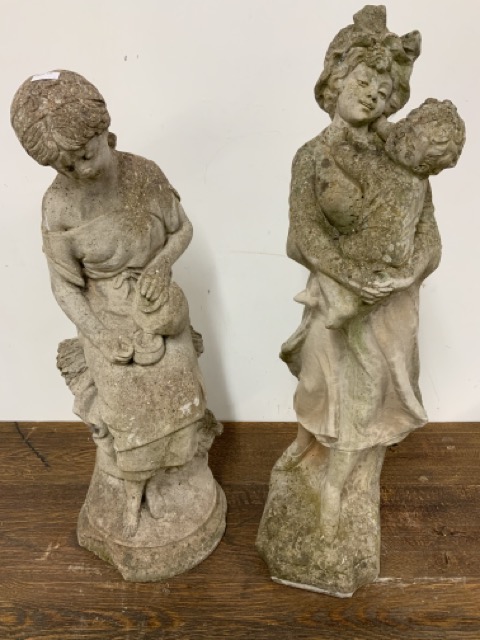 Two concrete garden statues, one of a washer woman and another with child W:25cm x D:25cm x H:63cm