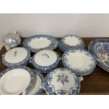 A Willow pattern meat plate and a large quantity of blue and white plates, turines etc