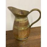 A large brass bound wooden jug W:38cm x D:25cm x H:45cm