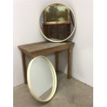 A pair of mid century round mirrors with early plastic frames. 63.5cm diameter
