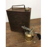 A vintage Esso petrol can and a brass burner