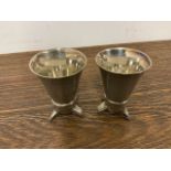 Two white metal stirrup cups