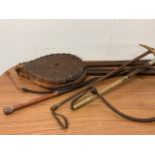 Antique items including riding crops and bellows