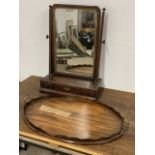 A victorian mahogany swing mirror with bevelled glass, three drawers to base also with a brass