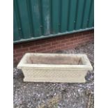 Reconstituted stone, rectangular plant stand with moulded geometric design to the front. Dimensions: