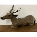 Large wooden recumbent Bavarian deer