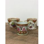 Two early 19th century Derby style coffee cans with similar tea cup and polychrome painted