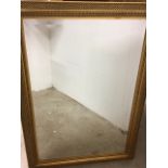 A modern gilt framed mirror with bevelled edge W:75cm x D:cm x H:106cm