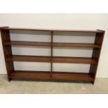 A set of stained pine shelves W:185cm x D:29cm x H:115cm