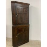 A Georgian oak two part corner cupboard each with single door. 190cm(h) x 95cm(w)