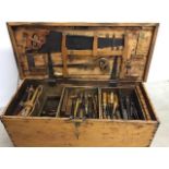 Victorian pine carpenters trunk with a large selection of tools
