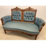 An early 20th century two seater upholstered sofa with carved detail, horse hair. W:170cm x D:70cm x