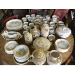 A near complete 18 person Poole pottery tea and dinner service in the springtime pattern.