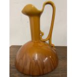Style of Christopher Dresser for Bretby. Large drip glaze wine ewer. Incised Bretby 945 England to