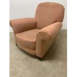 A victorian upholstered arm chair on bun feet to front with castors. W:95cm x D:95cm x H:80cm