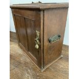 A 19th century oak smokers cabinet with brass handles and furniture. W:43cm x D:21cm x H:39cm
