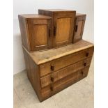 A mid century oak chest of drawers with triple cupboard above. W:96cm x D:56cm x H:110cm