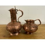Two hammered copper water jugs. W:14cm x D14:cm x H22:cm W:14cm x D:18cm x H:11cm