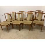 Eight Danish teak chairs with upholstered seats and backs. Domus Danica. W:51cm x D:47cm x H:85cm