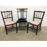A pair of mahogany inlaid childâ€™s chairs with one other.