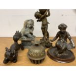 Various figurines, Chinese dogs and an oriental bell.