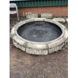 A sectional reconstituted stone fountain base with modern central well. approx 2m diameter.
