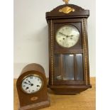 A mahogany wall clock, decorated with gilt decoration three bevelled glass panels also with an oak