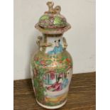 A late 19th early 20th century famille rose Cantonese lidded vase. W:6.5cm x D:6.5cm x H:15.5cm