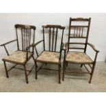 Three arts and craft carver arm chairs W:46cm x D:42cm x H:90cm